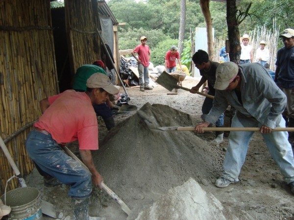 Men mixing concrete